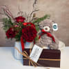 This gift set includes a petite red rose arrangement, one box of