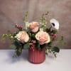 A petite arrangement full of beautiful blush and pink shades in a