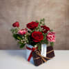 Our Crimson Crush arrangement paired with a box of Hedonist Salted Caramels.