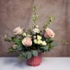 A luxe collection of blush and pink blooms in a dark pink