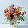 Bright and Fun bouquet. Features multi colored blossoms. Please specify any color