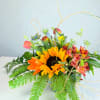 Bright arrangement featuring sunflowers. Please specify changes.