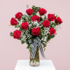 12 Long stem, premium red roses, designed with mixed greeneries, wax flowers