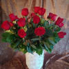 A bouquet (15 - 18) of fresh, radiant red roses is a