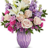 A charming and vibrant bouqet of pink roses, white lilies, hot pink