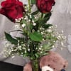 3 rose bud vase with cute plush animal attatched to the vase.