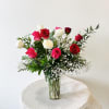 A beautiful mixture of valentine's day color roses in a vase.

Standard:12 roses
Deluxe: