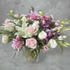 Surprise someone special with this playful pop of pink roses, dendrobium orchids