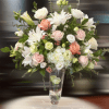 A dreamy bouquet of white and blush flowers is a comforting reminder