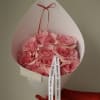 A delicate bouquet of fresh pink roses, thoughtfully arranged in a clean