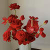 A bold red floral statement featuring premium roses, sculptural anthurium, and seasonal