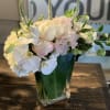 A mixture of peonies, sweet peas, hydrangeas, orchids, veronica with a touch