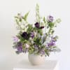 The Amethyst Arrangement features a balanced mix of soft lavender and deep