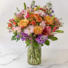 A vibrant and joyful arrangement bursting with color! Featuring golden yellow roses