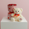 Small 7 wrapped roses and a 7 1/2 -inch teddy bear in