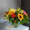 A small beautifully selected bunch of the freshest flowers in a vase
