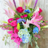 A fun, cheerful, and overall colorful arrangement! Send this arrangement to someone