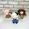 Plush farm animals in their overalls. 