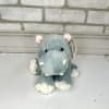 A sweet plush hippo on his tippy toes.
