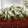 This Casket Spray Composed of roses, snapdragons, lilies and hydrangea, this luminous