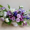 An elegant arrangment of violets and lavender, with a touch of soft