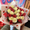 white and hot pink roses with strawberry and white colored wrapping, giving