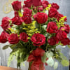 An opulent vase arrangement featuring four dozen long-stem red roses, crafted for