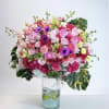This eye-catching arrangement features a staggering array of Roses, Anemones, Ranunculus, and