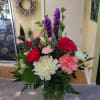 Arrangement filled in a glass vase. Each arrangement will VARY in colors
