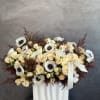 White anemones embody pure elegance and quiet grace. Their soft ivory petals