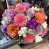 Petal Pop is a bright, low and compact designer's choice floral arrangement