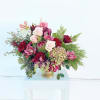 A beautiful collection of unique blooms with pink ice protea, candy-cane peppermint