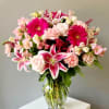 This arrangement features a vibrant mix of pink and white stargazer lilies