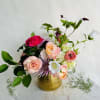 This sweet arrangement is the perfect gesture of love. It features blooms