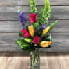 Simple and elegant , yet bright and bold. 
Lilies, roses, larkspurg and