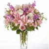 This lush, bountiful bouquet of pink blooms features an elegant mix of