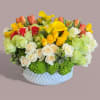 A bright, refreshing blend of Roses, Calla Lilies, Hydrangea, Tulips, and Cymbidium