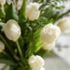 
A mixed bouquet with  white blooms, showcasing, white tulips, and eucalyptus