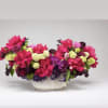 This bold, jewel-colored mix of blooms includes reflexed Roses, Peonies, Tulips, Hydrangea