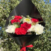 Handheld bouquet with a mix of red and white blooms.
Wrap color may