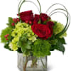 A cubed arrangement featuring roses, spray roses and green hydrangeas. Perfect for