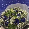A dozen blue roses with gold glitter on the petal , wrapping