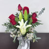 Simply Yours is a timeless Valentine&rsquo;s Day arrangement featuring rich red roses