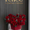 A timeless luxury hatbox arrangement featuring premium red roses accented with fresh