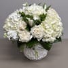 Beautiful combination of Hydrangeas, Roses, Lisianthus, Hypericum Berries and elegant greens and