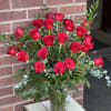 Traditionally arranged two dozen red roses. Greenery and filler will vary! 