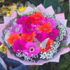 A bouquet of flowers made up of gerberas of different colors. A