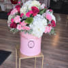 The flower bouquet is arranged with a mix of different flower types