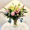 Graceful and expressive, Softly Spoken showcases a mix of pink lilies, blush