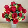 Amazing silk arrangement with 18 red roses in a bed of green